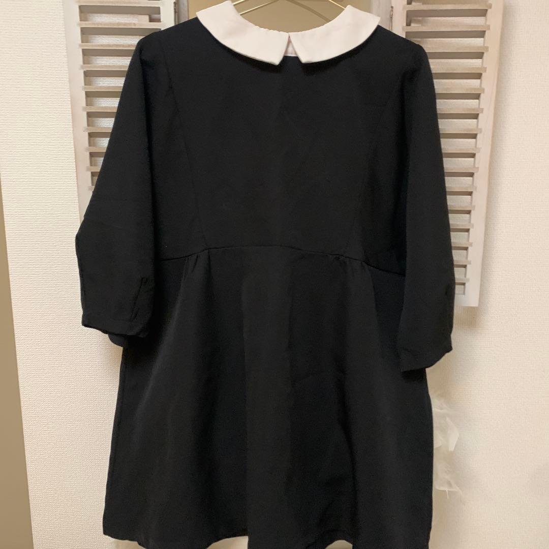 Black A-line blouse with white collar
