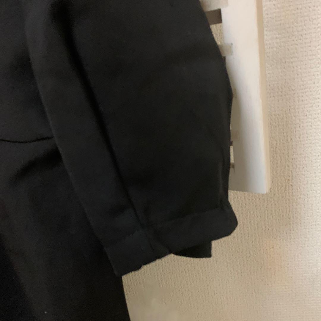 Black A-line blouse with white collar